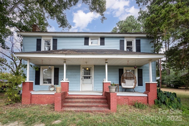 12137 Renee Ford Rd Unit 3, Stanfield, NC 28163 - view of front of home with a porch, a chimney, and roof with shingles