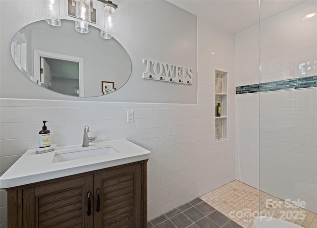 975 Buchanan Loop, Sylva, NC 28779 - full bathroom with tile walls, vanity, a walk in shower, and tile patterned floors