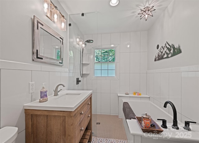 975 Buchanan Loop, Sylva, NC 28779 - full bathroom with tile walls, a garden tub, vanity, tiled shower, and tile patterned floors