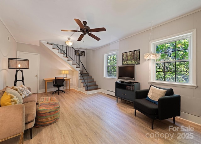 975 Buchanan Loop, Sylva, NC 28779 - living room featuring wood finished floors, stairs, healthy amount of natural light, and ceiling fan