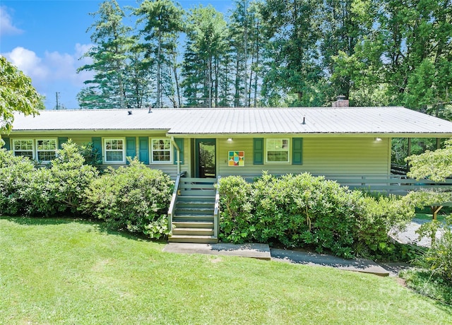 975 Buchanan Loop, Sylva, NC 28779 - ranch-style home featuring a front yard, a metal roof, stairway, and covered porch