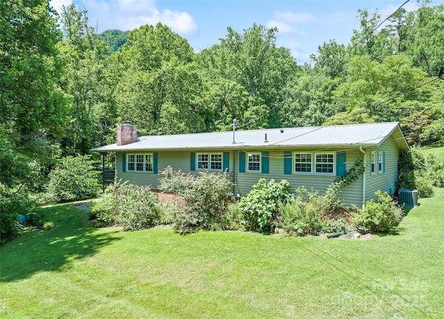 975 Buchanan Loop, Sylva, NC 28779 - ranch-style home featuring a chimney, a front yard, and a view of trees