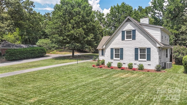 4201 Tyndale Ave, Charlotte, NC 28210 - view of front facade featuring crawl space, a chimney, a front lawn, and brick siding
