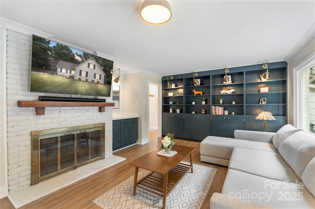 4201 Tyndale Ave, Charlotte, NC 28210 - living area featuring wood finished floors and a brick fireplace