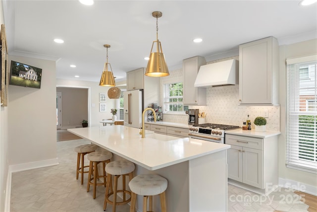 4201 Tyndale Ave, Charlotte, NC 28210 - kitchen with premium range hood, premium appliances, a kitchen breakfast bar, backsplash, and an island with sink