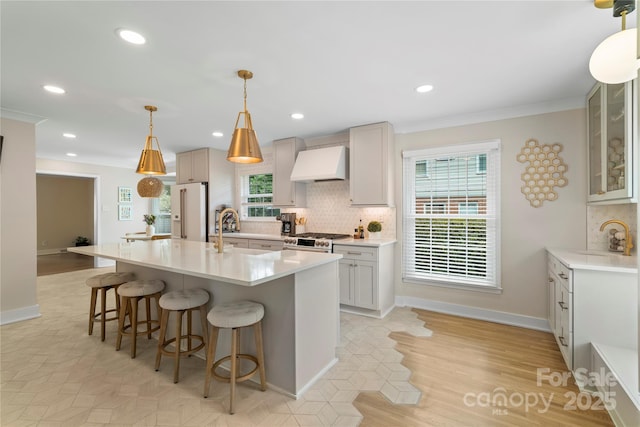4201 Tyndale Ave, Charlotte, NC 28210 - kitchen with custom exhaust hood, white fridge with ice dispenser, a breakfast bar area, backsplash, and crown molding