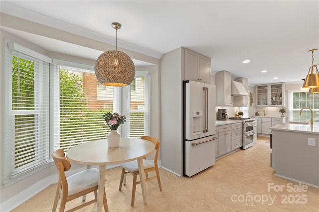 4201 Tyndale Ave, Charlotte, NC 28210 - kitchen featuring white fridge with ice dispenser, double oven range, custom exhaust hood, light countertops, and tasteful backsplash