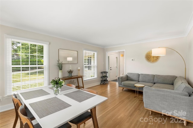 4201 Tyndale Ave, Charlotte, NC 28210 - dining area with crown molding, light wood-style floors, and healthy amount of natural light