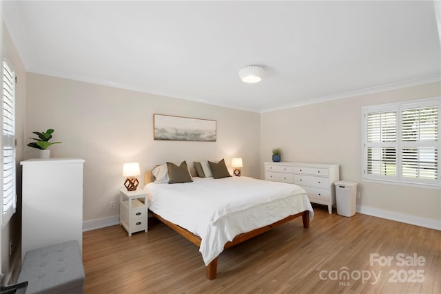 4201 Tyndale Ave, Charlotte, NC 28210 - bedroom featuring light wood finished floors and ornamental molding