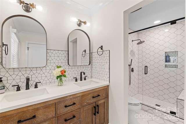 4201 Tyndale Ave, Charlotte, NC 28210 - full bathroom featuring double vanity, a shower stall, crown molding, and decorative backsplash
