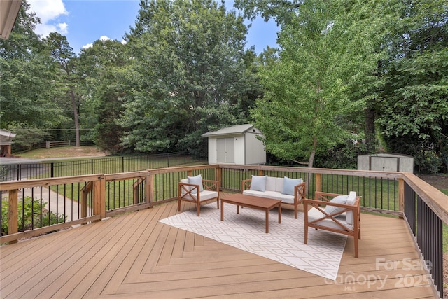 4201 Tyndale Ave, Charlotte, NC 28210 - wooden deck with a storage unit, a fenced backyard, an outdoor hangout area, and view of scattered trees