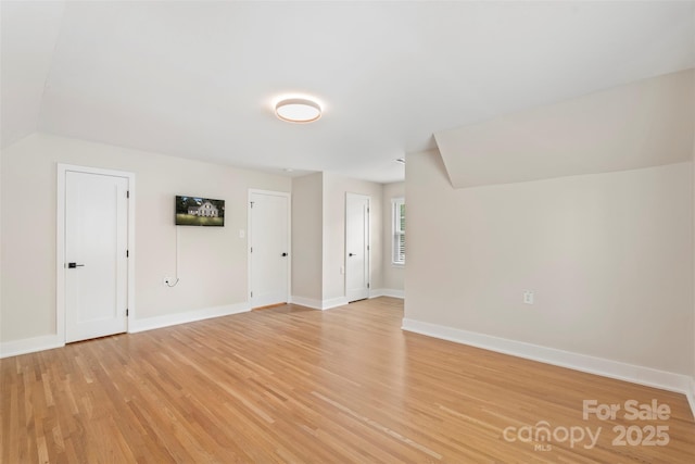 4201 Tyndale Ave, Charlotte, NC 28210 - additional living space featuring light wood-type flooring and vaulted ceiling