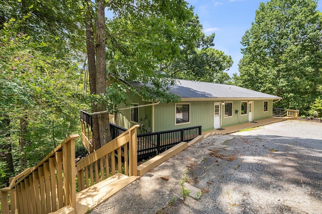 263 Shannons Walk, Lake Lure, NC 28746 - view of front of house with a metal roof and a wooden deck