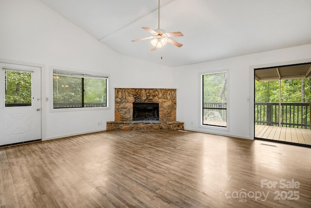 263 Shannons Walk, Lake Lure, NC 28746 - unfurnished living room featuring a ceiling fan, wood finished floors, a fireplace, and high vaulted ceiling
