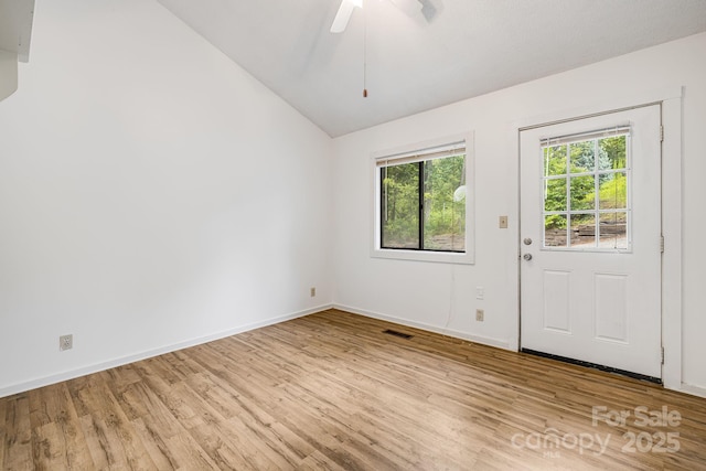 263 Shannons Walk, Lake Lure, NC 28746 - empty room with lofted ceiling, healthy amount of natural light, wood finished floors, and ceiling fan