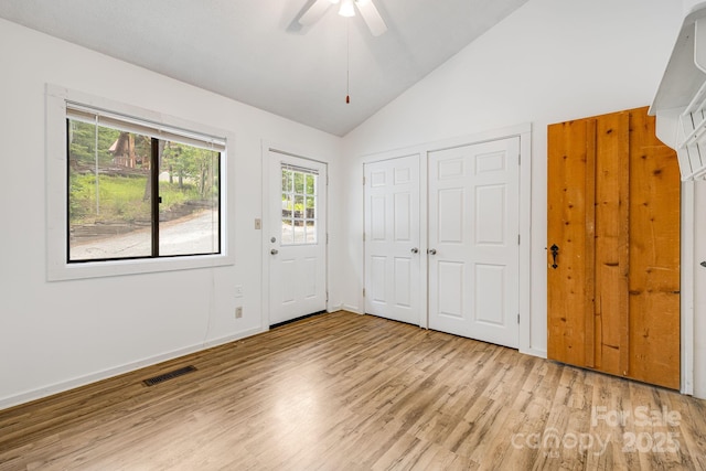 263 Shannons Walk, Lake Lure, NC 28746 - unfurnished bedroom with light wood finished floors, ceiling fan, a closet, and high vaulted ceiling