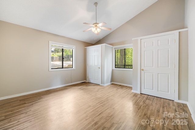 263 Shannons Walk, Lake Lure, NC 28746 - unfurnished bedroom with light wood-style floors, high vaulted ceiling, and ceiling fan