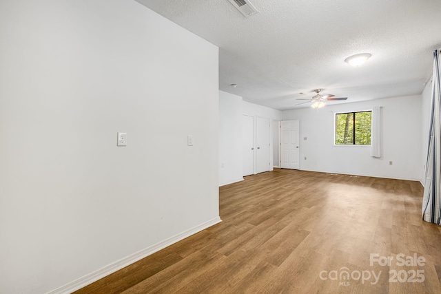 263 Shannons Walk, Lake Lure, NC 28746 - spare room featuring a ceiling fan, wood finished floors, and a textured ceiling