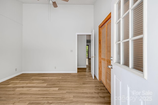 263 Shannons Walk, Lake Lure, NC 28746 - unfurnished room featuring light wood-type flooring, a high ceiling, and ceiling fan