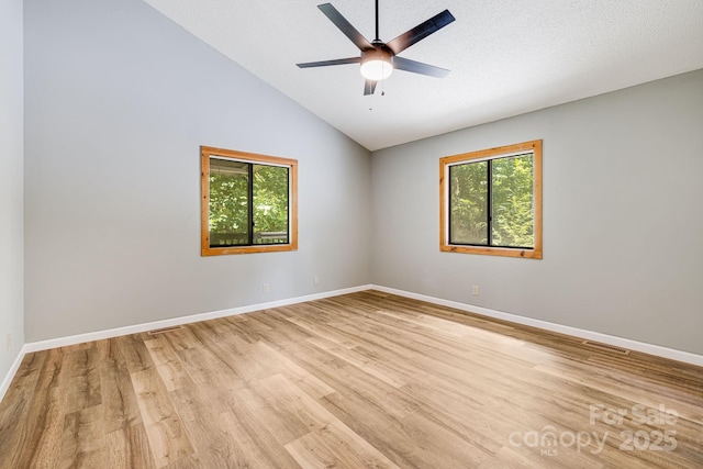263 Shannons Walk, Lake Lure, NC 28746 - empty room featuring plenty of natural light, light wood finished floors, lofted ceiling, and a ceiling fan