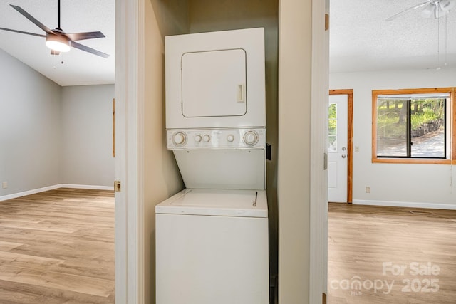263 Shannons Walk, Lake Lure, NC 28746 - washroom with a ceiling fan, stacked washer / drying machine, light wood-style flooring, and a textured ceiling