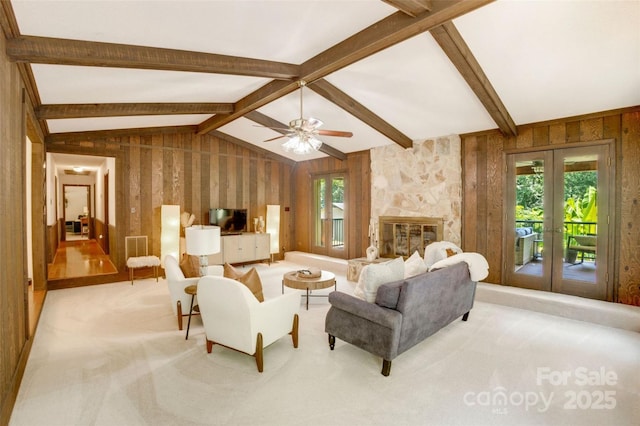 924 Holly Rd, Rock Hill, SC 29730 - carpeted living area featuring french doors, ceiling fan, wood walls, and a fireplace