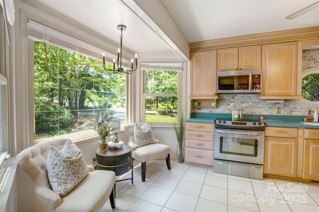 924 Holly Rd, Rock Hill, SC 29730 - kitchen featuring stainless steel appliances, light brown cabinets, light tile patterned floors, a chandelier, and tasteful backsplash