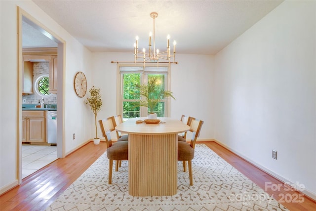 924 Holly Rd, Rock Hill, SC 29730 - dining area featuring a chandelier, healthy amount of natural light, and light wood finished floors