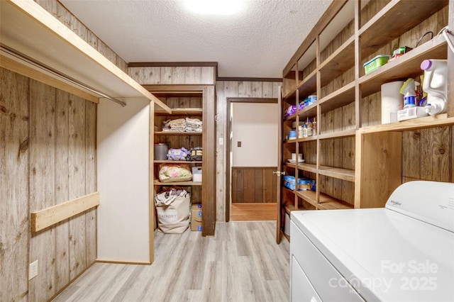 924 Holly Rd, Rock Hill, SC 29730 - laundry room with washer / dryer, wood walls, light wood-type flooring, and a textured ceiling