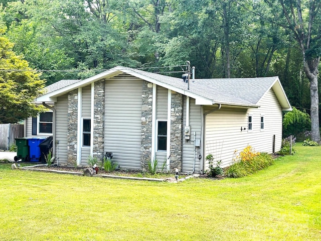 25 Norman Rd, Fletcher, NC 28732 - view of home's exterior with stone siding, a yard, and a shingled roof