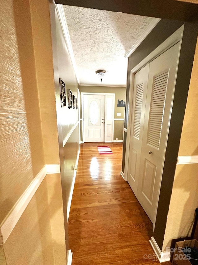 25 Norman Rd, Fletcher, NC 28732 - hall featuring wood finished floors, crown molding, and a textured ceiling