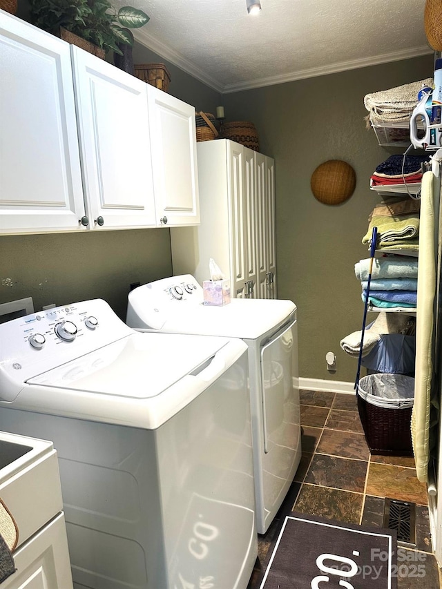 25 Norman Rd, Fletcher, NC 28732 - laundry room with washer and dryer, cabinet space, ornamental molding, and dark stone finish floors