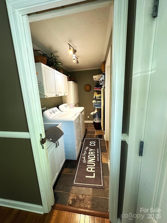 25 Norman Rd, Fletcher, NC 28732 - laundry room featuring cabinet space, separate washer and dryer, ornamental molding, dark wood-style flooring, and a textured ceiling