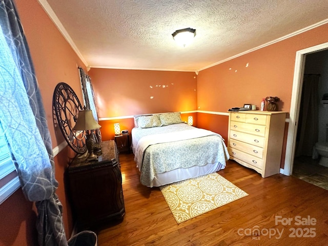 25 Norman Rd, Fletcher, NC 28732 - bedroom featuring ornamental molding, wood finished floors, and a textured ceiling