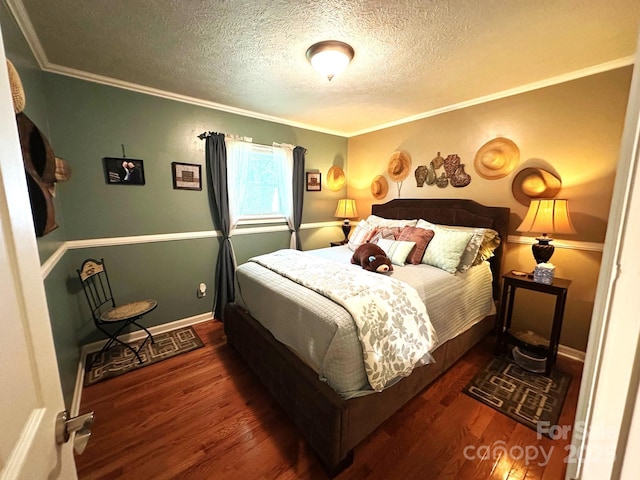 25 Norman Rd, Fletcher, NC 28732 - bedroom featuring wood finished floors, a textured ceiling, and ornamental molding