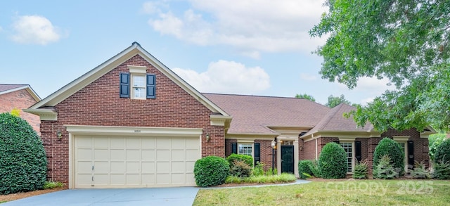 10511 Pullengreen Dr, Charlotte, NC 28277 - traditional-style home with brick siding, driveway, roof with shingles, and a front yard