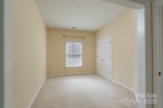 10511 Pullengreen Dr, Charlotte, NC 28277 - unfurnished bedroom with light colored carpet and a textured ceiling