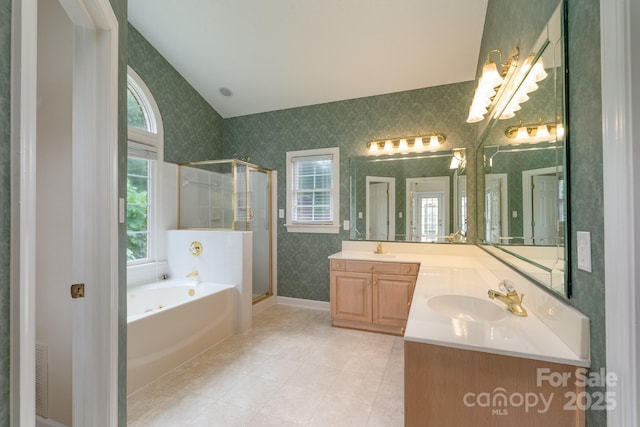 10511 Pullengreen Dr, Charlotte, NC 28277 - full bathroom featuring wallpapered walls, double vanity, a bath, a shower stall, and a chandelier