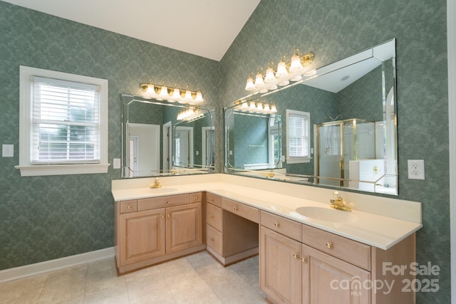 10511 Pullengreen Dr, Charlotte, NC 28277 - bathroom featuring double vanity, a stall shower, lofted ceiling, and tile patterned flooring