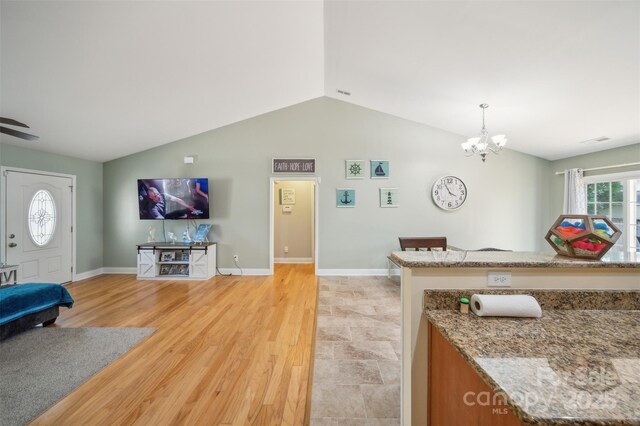 239 Shellbank Dr, Sneads Ferry, NC 28460 - living area featuring lofted ceiling, a chandelier, and light wood-type flooring