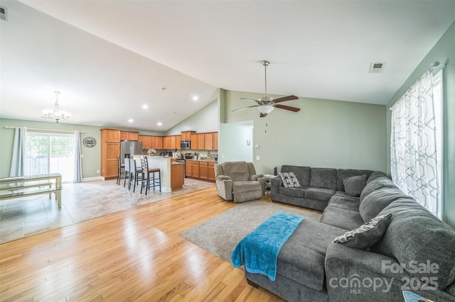239 Shellbank Dr, Sneads Ferry, NC 28460 - living room featuring a chandelier, light wood finished floors, vaulted ceiling, a ceiling fan, and recessed lighting