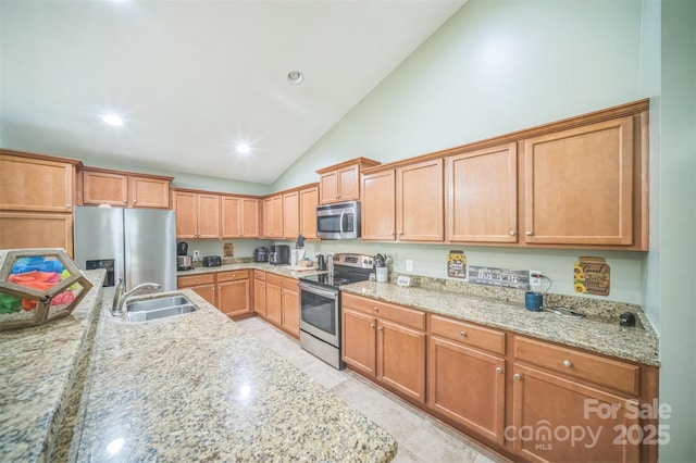 239 Shellbank Dr, Sneads Ferry, NC 28460 - kitchen with appliances with stainless steel finishes, vaulted ceiling, light stone countertops, and recessed lighting