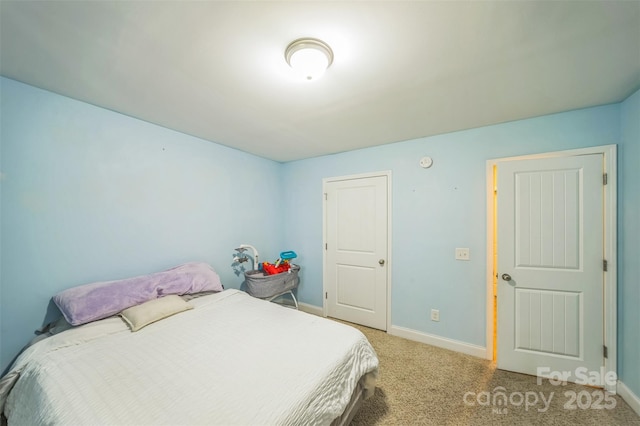 239 Shellbank Dr, Sneads Ferry, NC 28460 - bedroom featuring baseboards and light carpet
