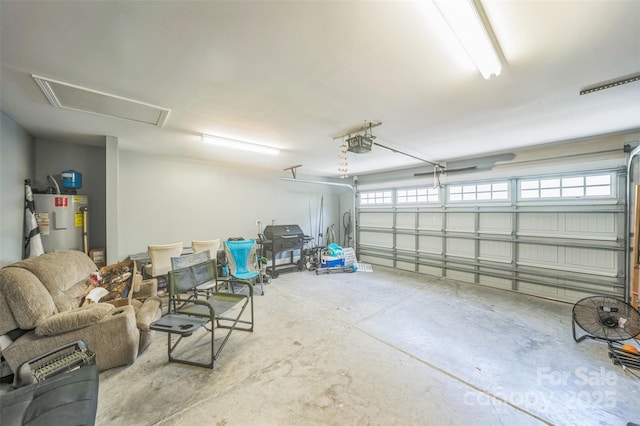 239 Shellbank Dr, Sneads Ferry, NC 28460 - garage featuring electric water heater and a garage door opener