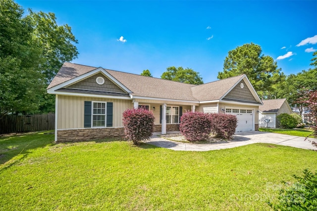 239 Shellbank Dr, Sneads Ferry, NC 28460 - ranch-style house with stone siding, an attached garage, and concrete driveway