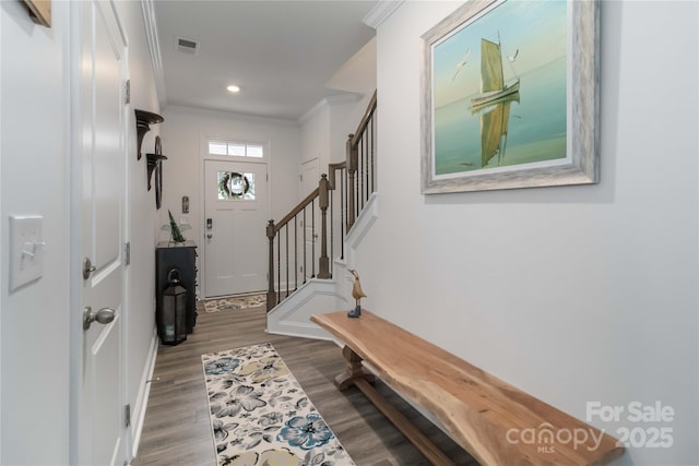 1076 Chicory Trce, Clover, SC 29710 - entryway with crown molding, wood finished floors, stairway, and recessed lighting