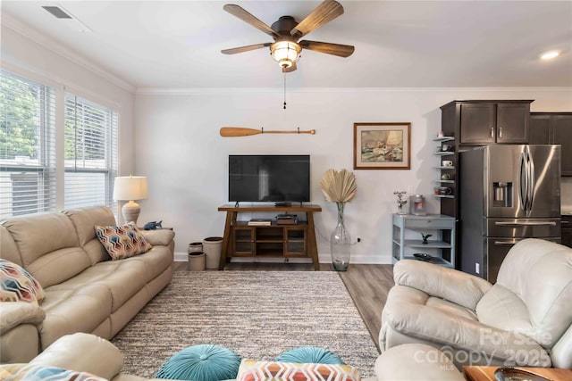 1076 Chicory Trce, Clover, SC 29710 - living room with ceiling fan, ornamental molding, and light wood finished floors