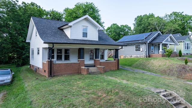 242 8th Avenue Dr SW, Hickory, NC 28602 - bungalow-style home with covered porch, a front lawn, roof with shingles, and brick siding