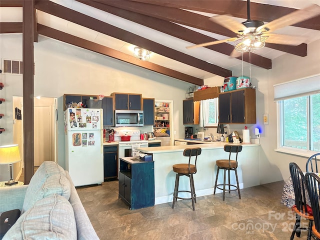 171 Windy Hill Dr, Franklin, NC 28734 - kitchen featuring white appliances, light countertops, a peninsula, ceiling fan, and a kitchen bar