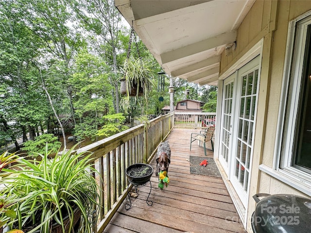 171 Windy Hill Dr, Franklin, NC 28734 - wooden terrace with view of scattered trees